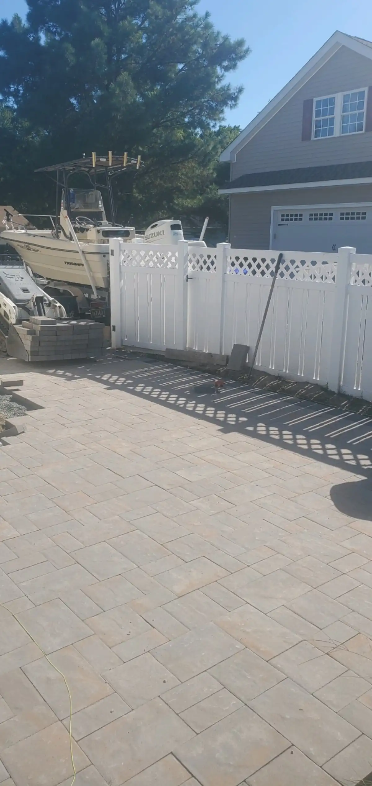 Round stone fire pit on paver patio