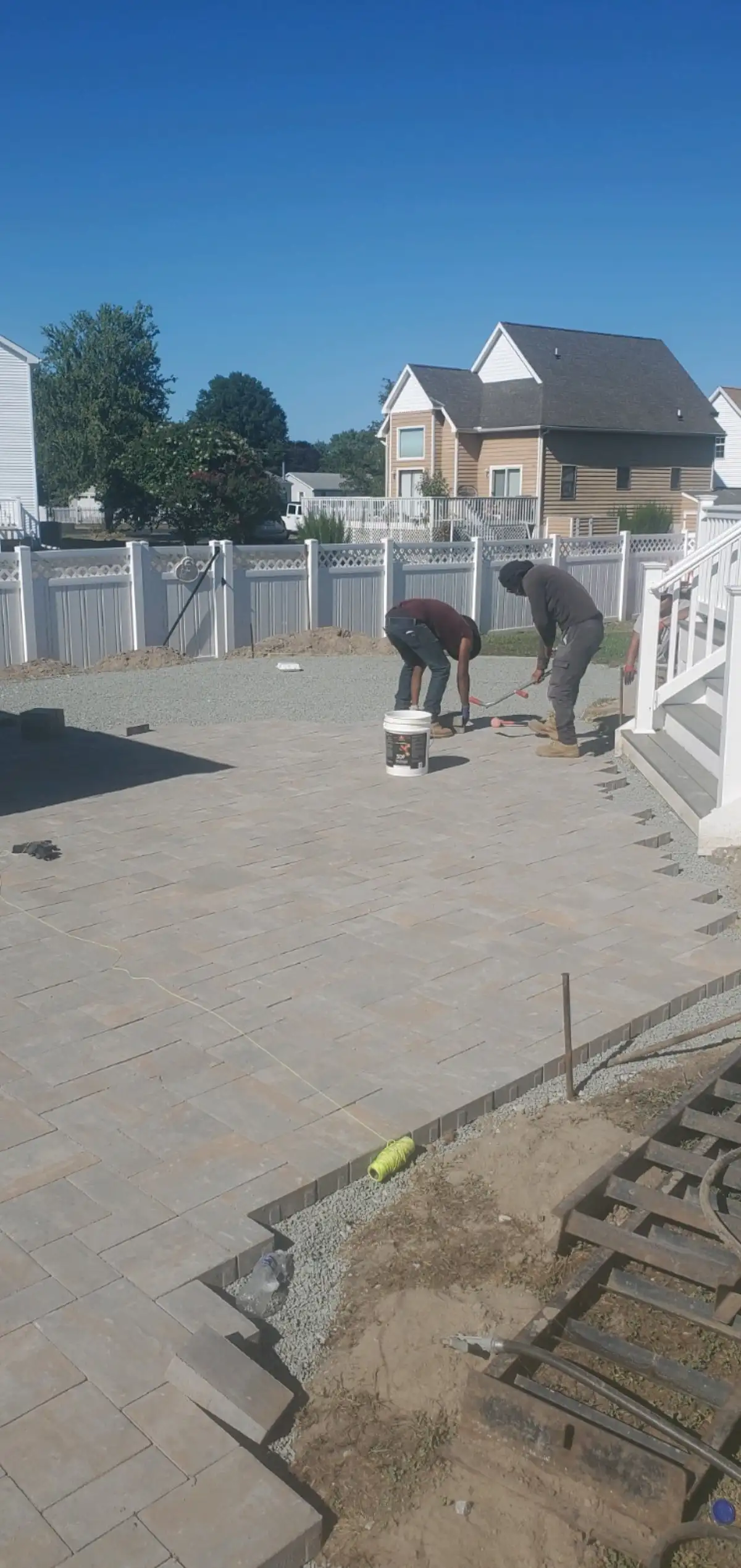 Custom-shaped fire pit with seating wall