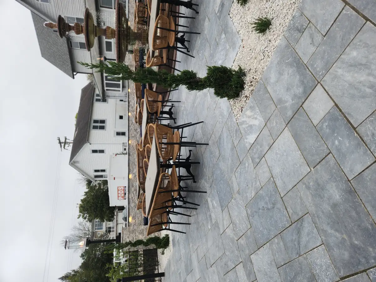 Paver patio surrounding pool deck area in Sussex County