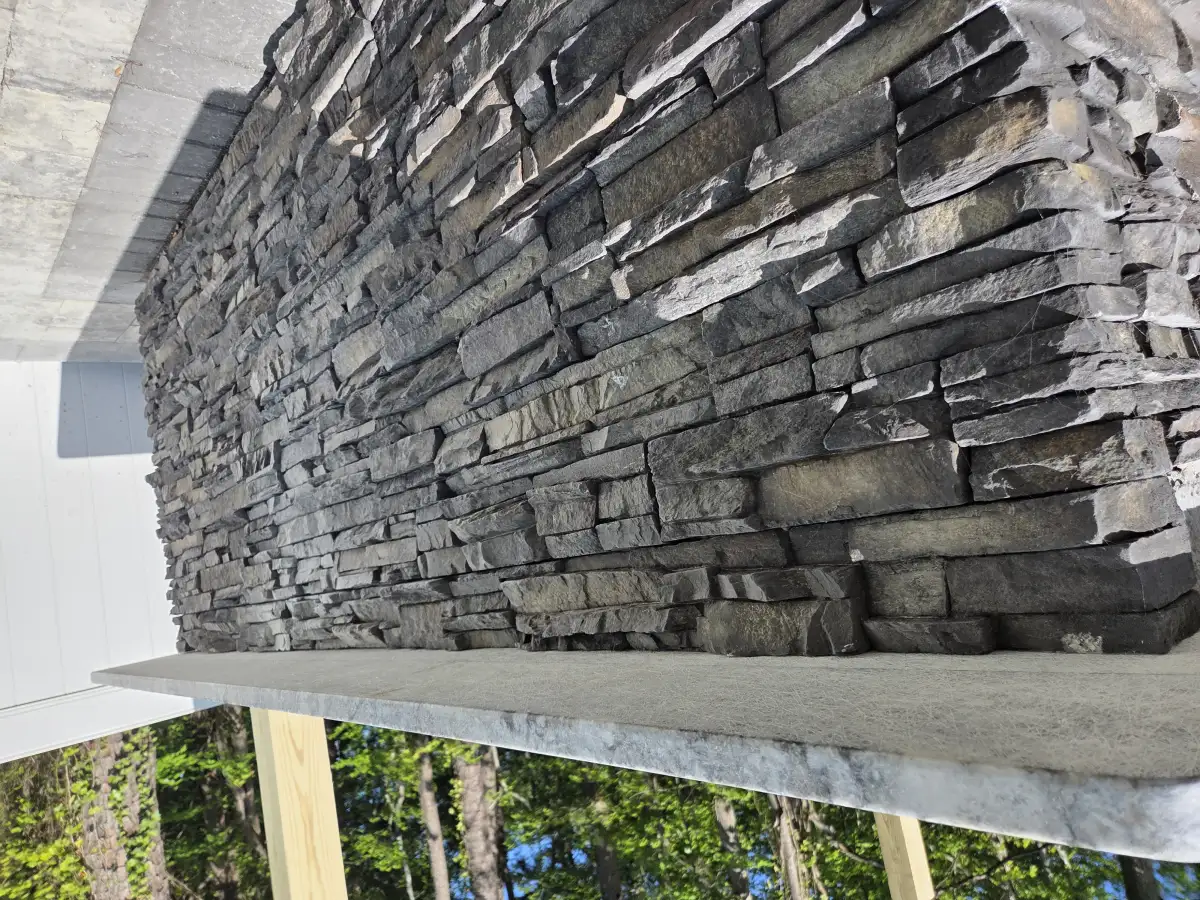 Stone retaining wall with integrated landscaping in Sussex County