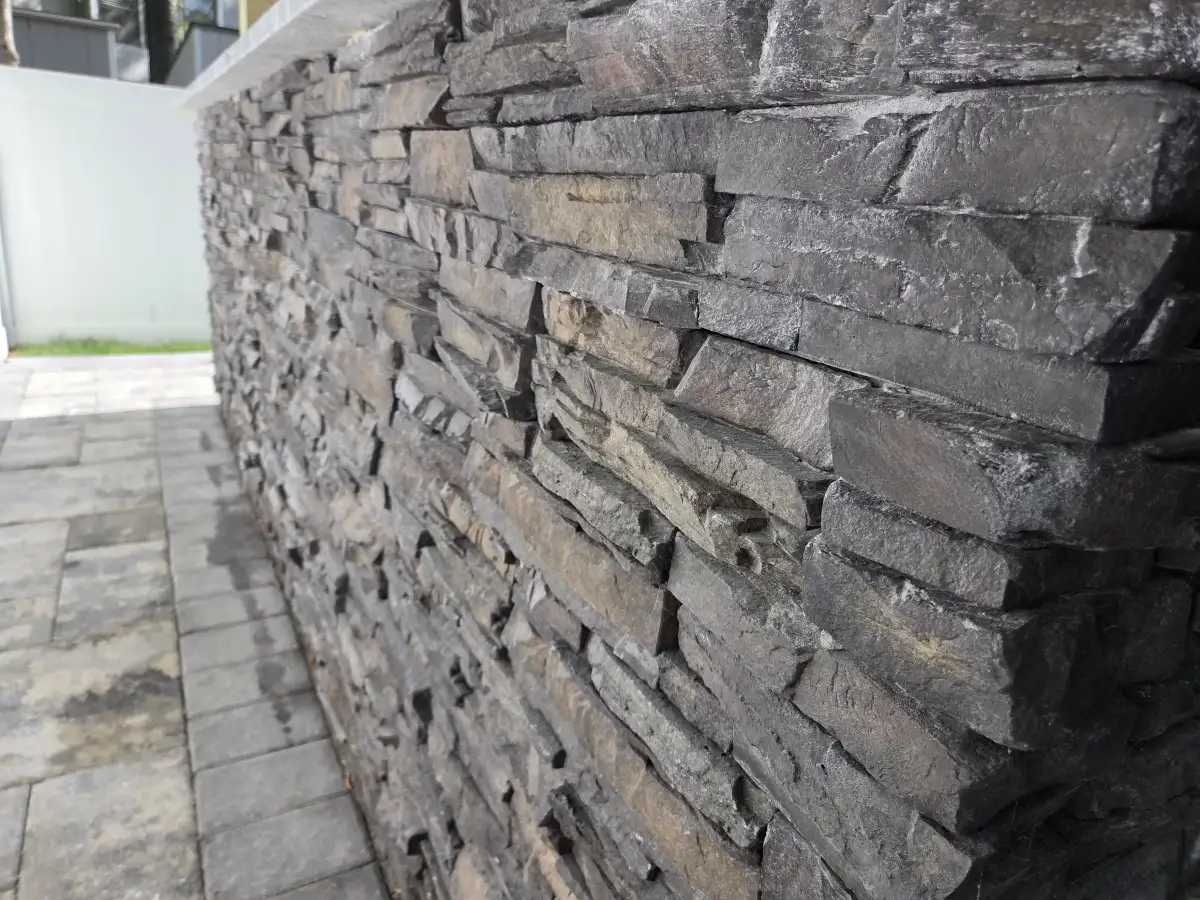 Stone retaining wall with integrated plantings in Delaware