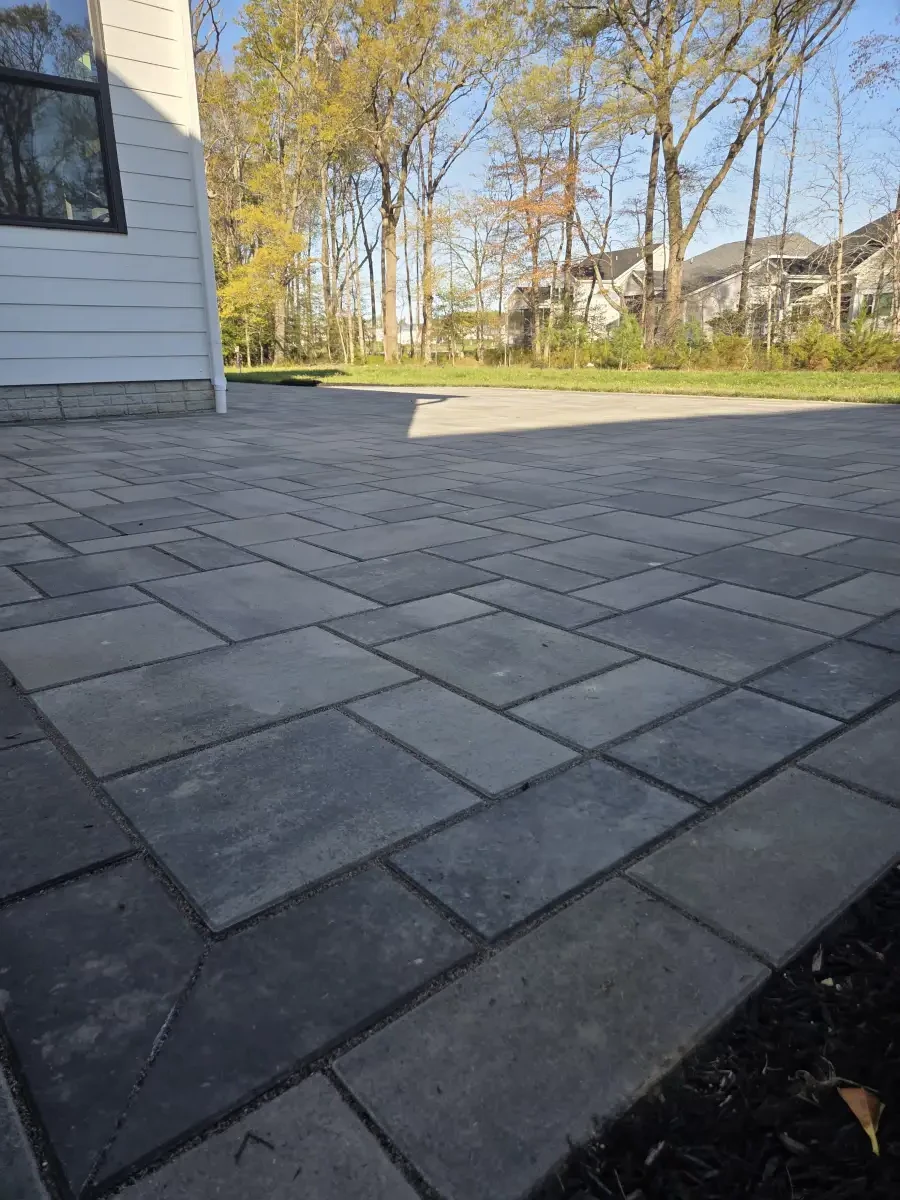 Gray paver patio with a dark border