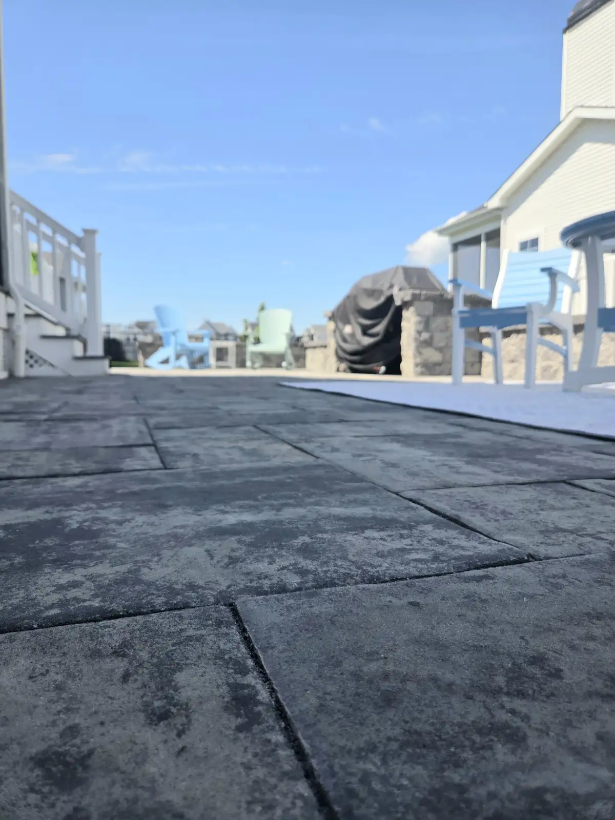 Just Imagine crew actively working on a hardscape construction project